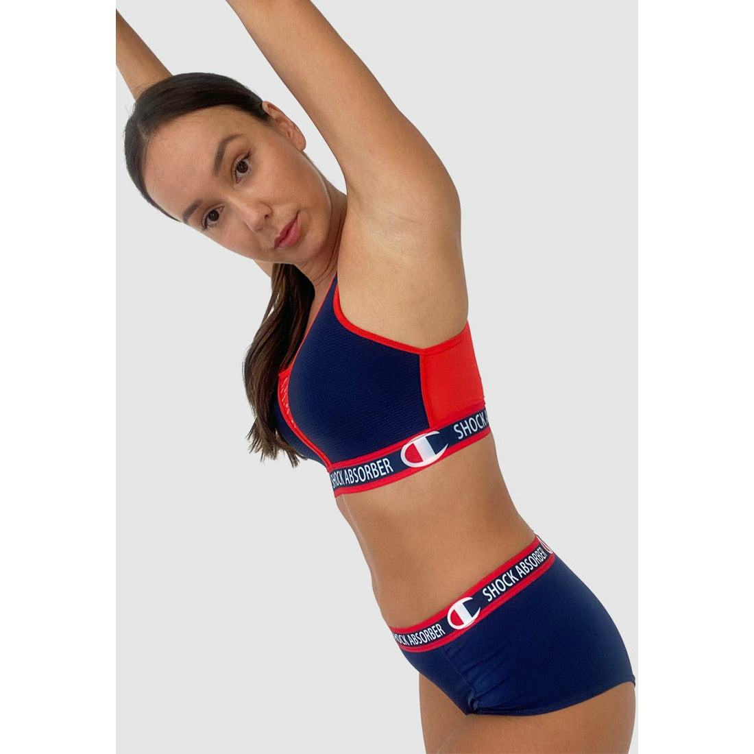 Shock Absorber X Champion padded high support running bra in navy and red